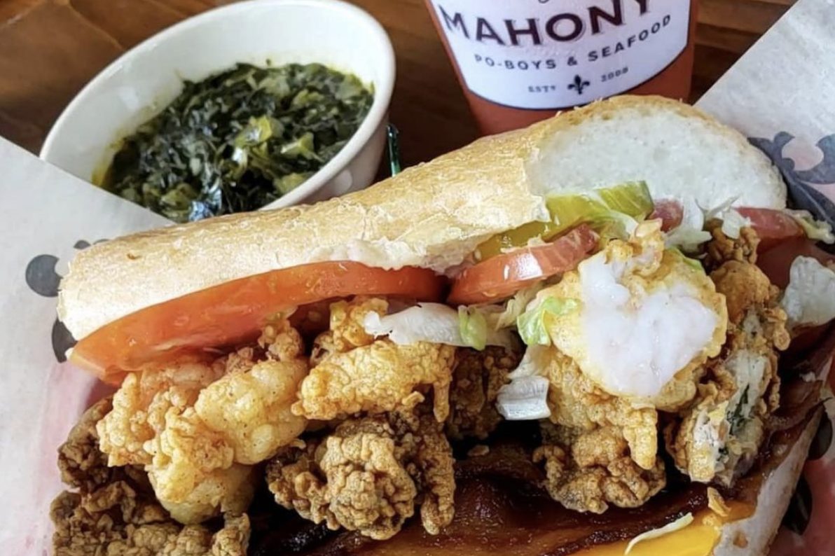 Poboy with fried shrimp, oysters, and bacon