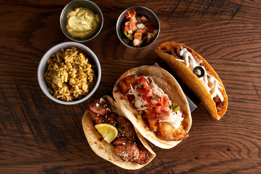 image of three tacos from above